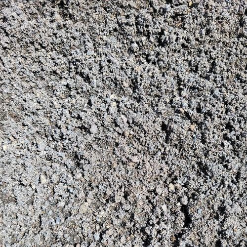 Close-up of gray coarse sand.
