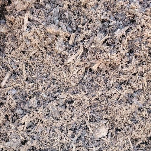 Close-up of the fine, fibrous texture of Shovel and Thumb’s dark hemlock bark product.